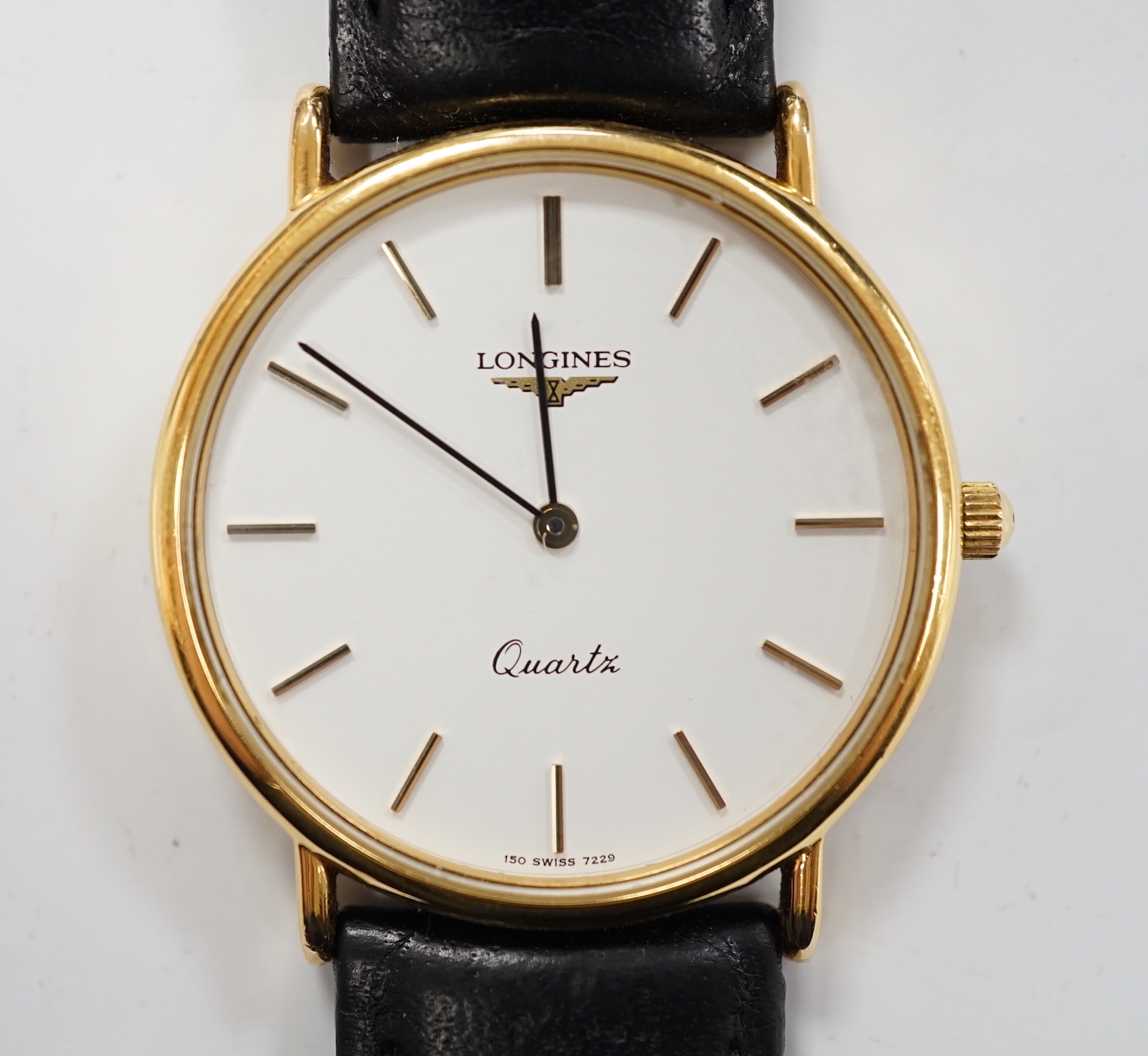 A gentleman's modern steel and gold plated Longines quartz dress wrist watch, on associated leather strap, with Longines box.